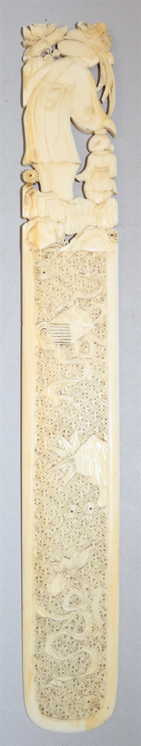 A Chinese export ivory page turner and a similar panel, late 19th century, 30cm and 10.5cm